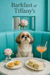 Shih Tzu seated on a turquoise banquette beside a marble table holding two peach tartlets stacks of tea sandwiches a pink cocktail with striped straw and a small pink blossom vase