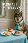 Shikoku dog wearing a turquoise scarf seated at a turquoise cloth-covered table with plates of egg salad tartlets fruit tarts and a peach brunch cocktail