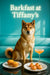 Shikoku wearing a turquoise silk scarf seated on a turquoise banquette behind a black café table with two muffins four tartlets topped with salmon mousse and a peach brunch cocktail