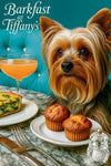 Silky Terrier seated at a marble table with two golden muffins a slice of spinach quiche silverware and a peach brunch cocktail against a turquoise tufted banquette