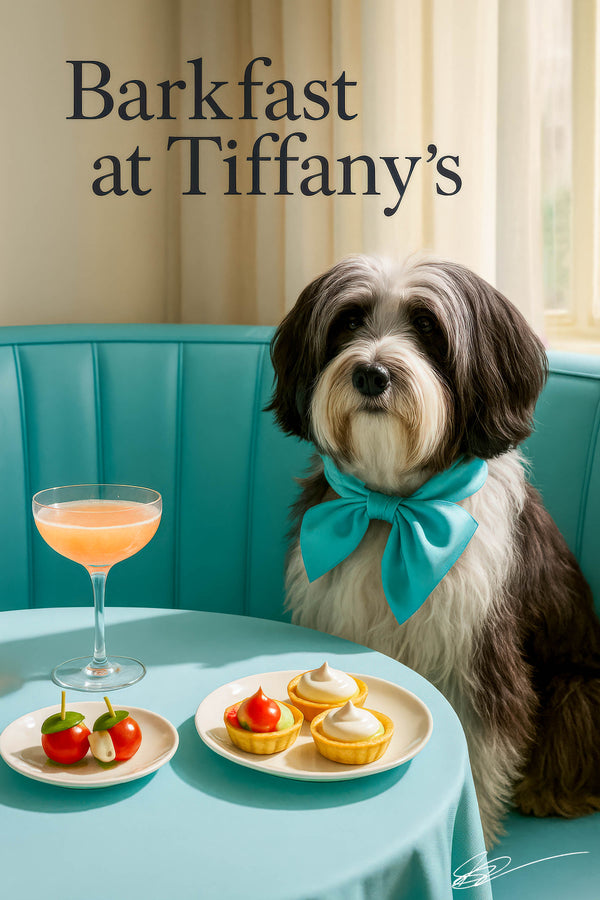 Tibetan Terrier wearing a Tiffany-blue bow seated on a turquoise banquette beneath a Barkfast at Tiffany’s sign