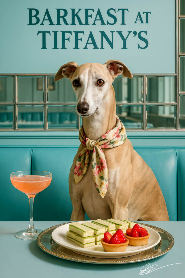 Whippet wearing a floral scarf seated at a teal booth with cucumber tea sandwiches two strawberry tarts and a peach cocktail on a round metal table