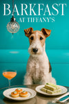 Wire fox terrier standing beside a metal table topped with salmon tartlets a stack of cucumber tea sandwiches and a peach cocktail under a cut-glass pendant in a teal dining nook