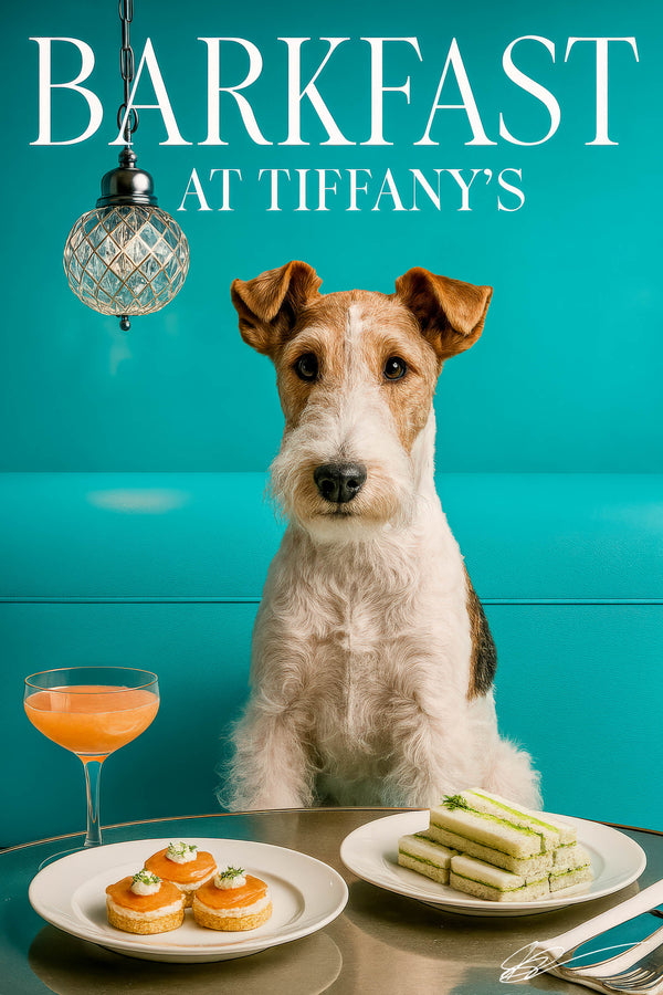 Wire fox terrier standing beside a metal table topped with salmon tartlets a stack of cucumber tea sandwiches and a peach cocktail under a cut-glass pendant in a teal dining nook