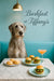 Wolfhound seated at a marble table with cheese scones miniature arugula sliders and a peach cocktail under a brass pendant in a teal dining nook