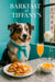 Australian Shepherd wearing a Tiffany-blue scarf seated at a café table with ham and cheese croissant sandwiches, melon cubes, and a peach cocktail